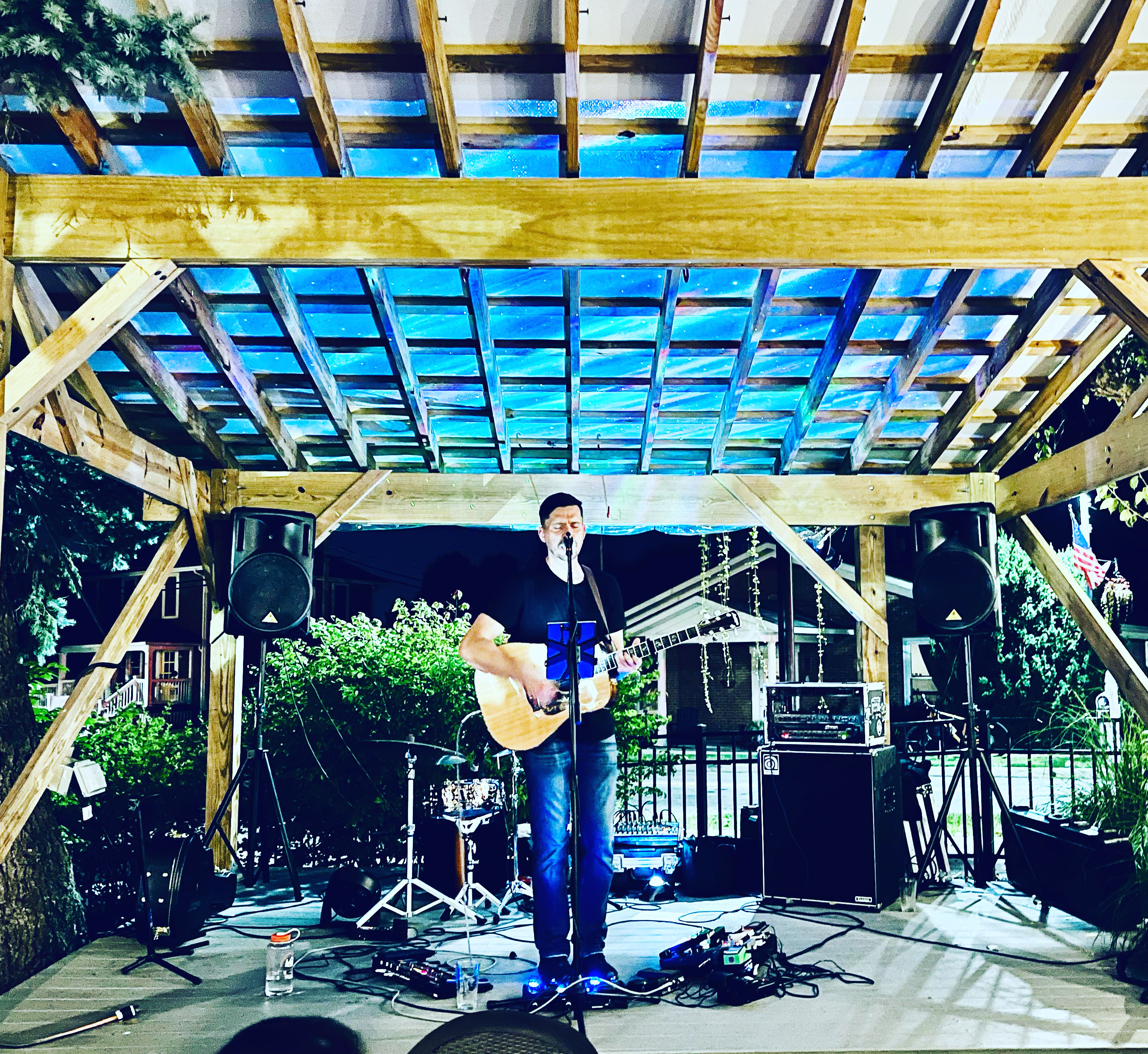 Eric Z performing live on stage at night